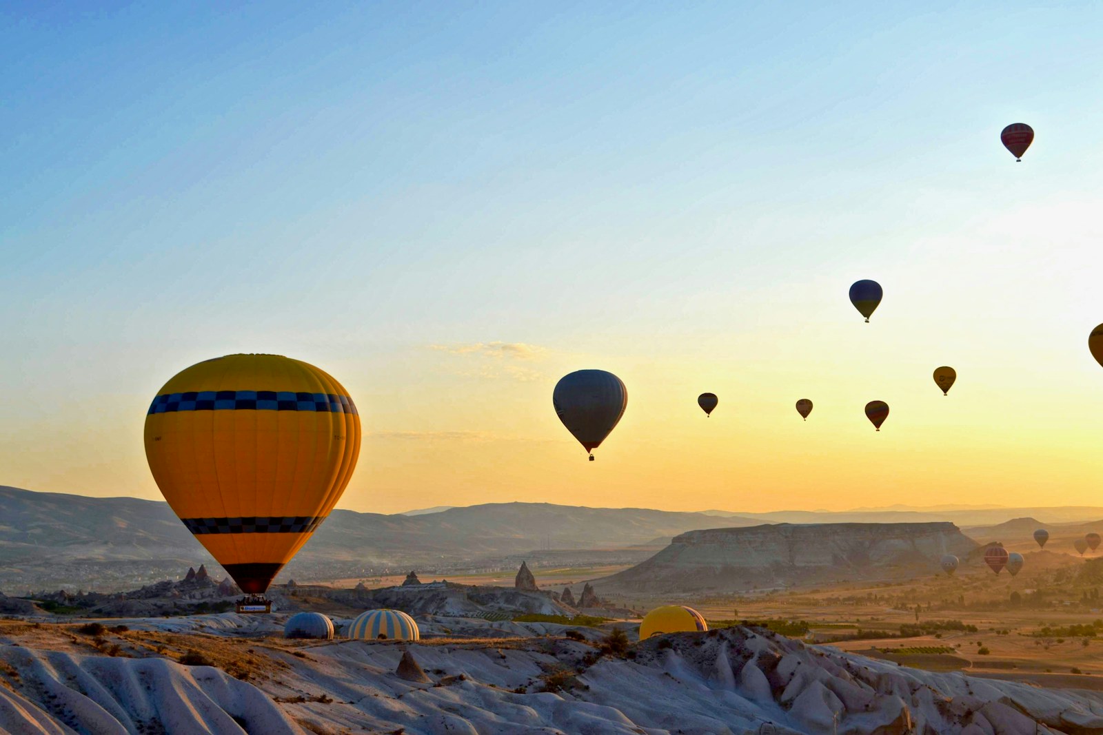 Hot air balloons floating over Cappadocia